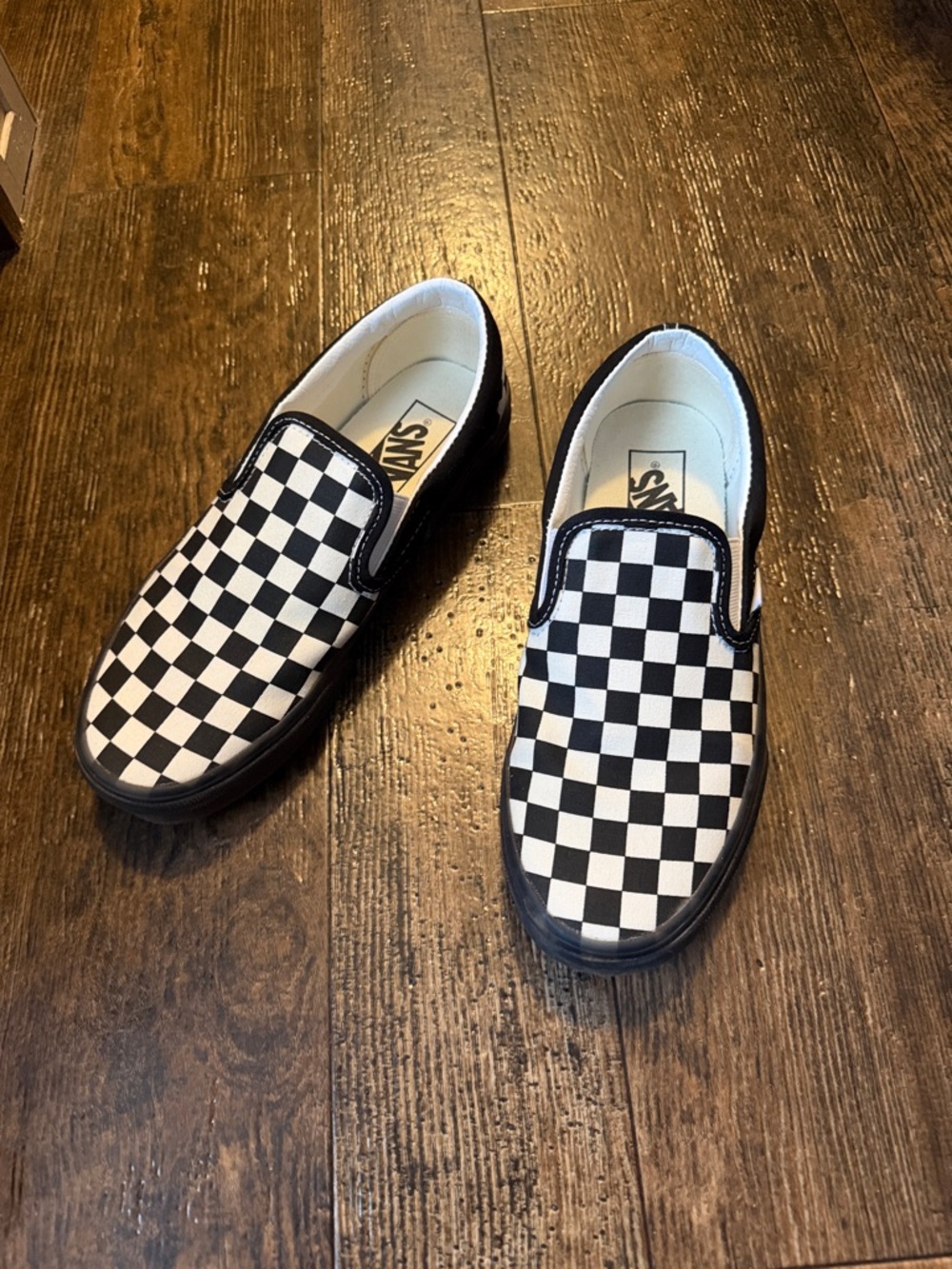 Vans Black & White Checkerboard Slip-On Sneakers